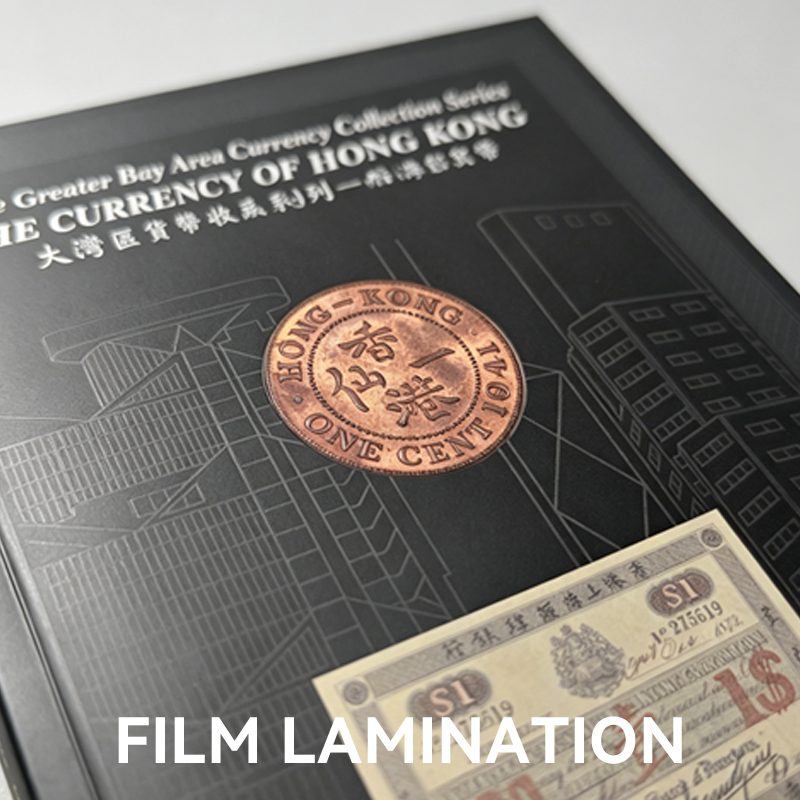 Close-up of a printed book cover with smooth film lamination, protecting the intricate dark design and enhancing durability.