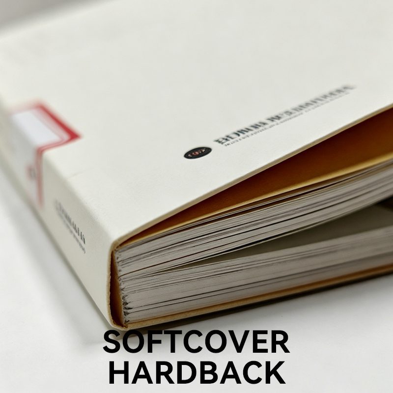 Close-up of a flexibound softcover hardback book showing the flexible cover material slightly overhanging the text block.