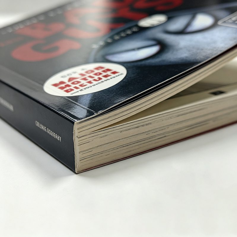 Close-up of a perfect bound catalog showing the flat, glued spine and professional crisp edges.