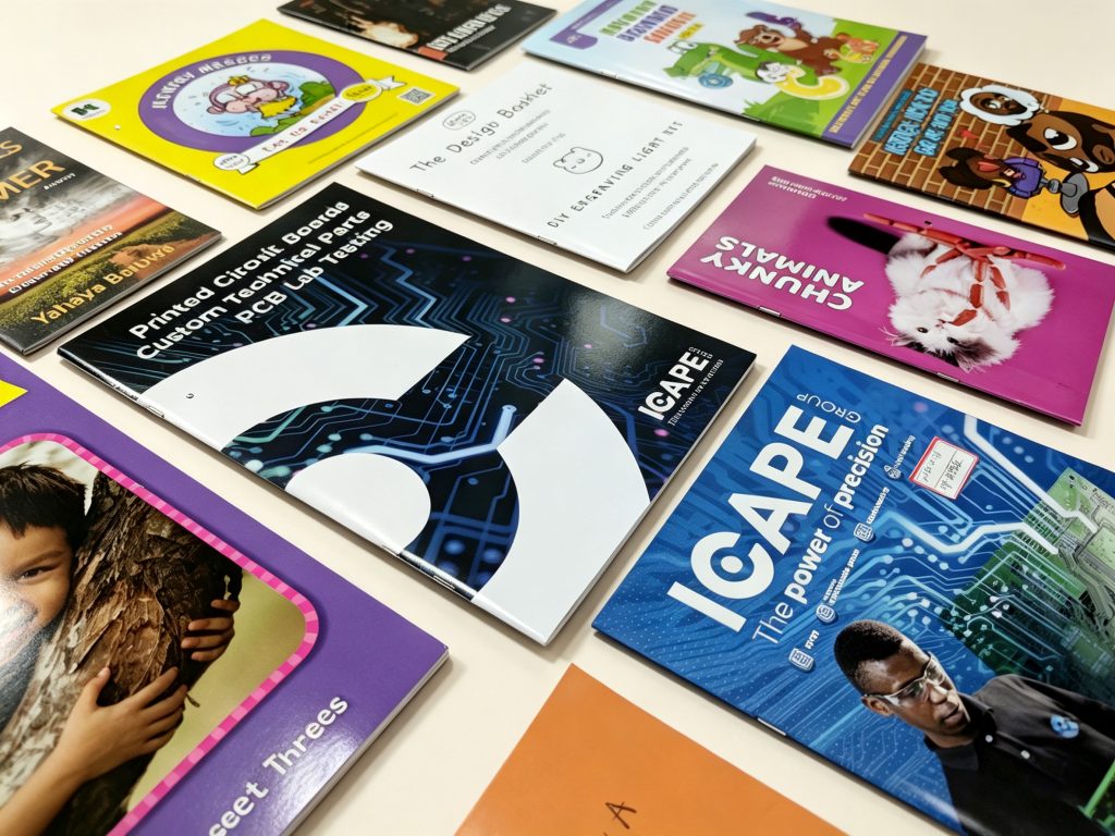 Stack of high-quality saddle stitch catalogs manufactured by our professional printing facility