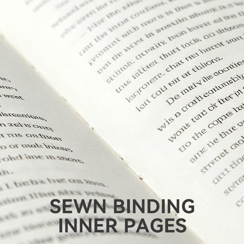 Close-up of open book inner pages showing the exposed thread of sewn binding, allowing the book to lay completely flat.